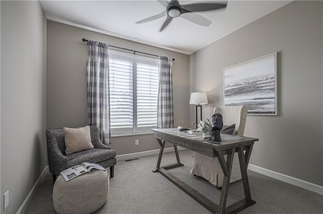 carpeted office space with ceiling fan