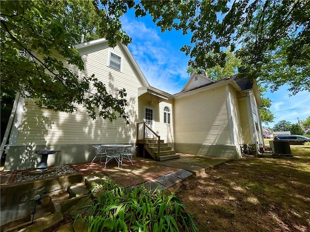 rear view of property featuring a patio