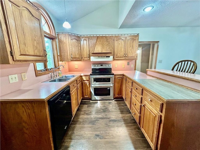 kitchen with black dishwasher, a peninsula, vaulted ceiling, double oven range, and a sink