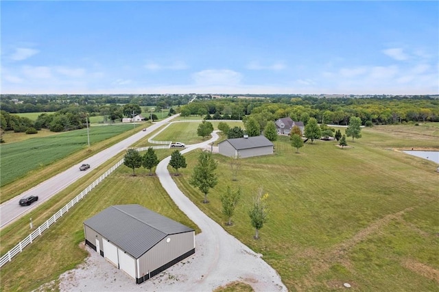 birds eye view of property with a rural view