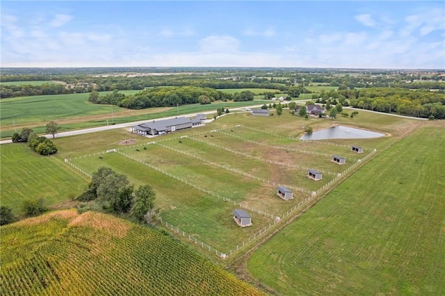 aerial view featuring a rural view and a water view