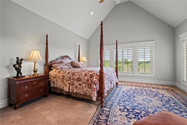 carpeted bedroom with vaulted ceiling and ceiling fan