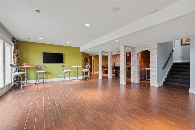 unfurnished living room with hardwood / wood-style floors and plenty of natural light