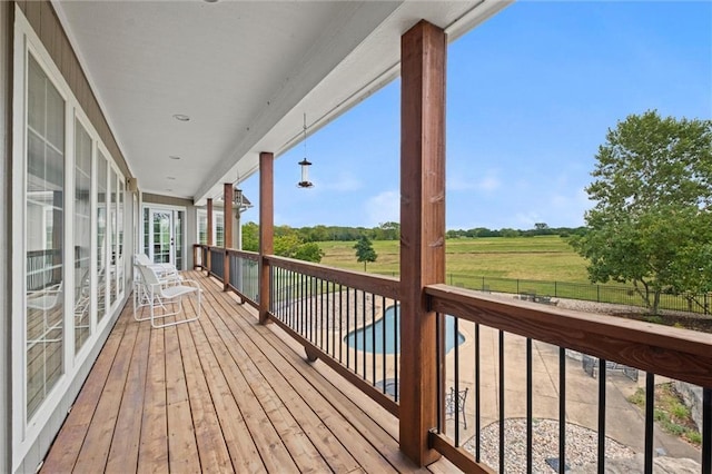 wooden terrace with a rural view