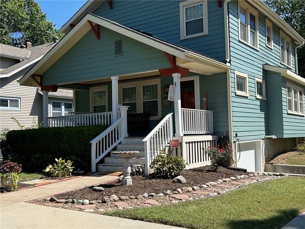 view of front of property with a garage and a porch