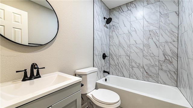 full bathroom featuring toilet, tiled shower / bath combo, and vanity