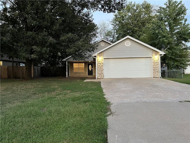 view of front of home with a garage and a front yard