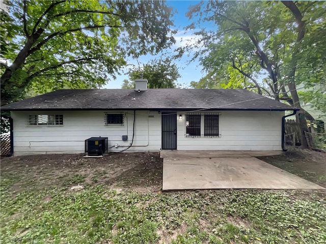 back of property with a patio and central air condition unit