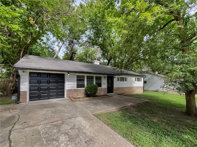 ranch-style home featuring a garage and a front yard