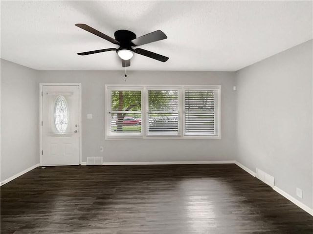 entryway with ceiling fan and dark hardwood / wood-style floors