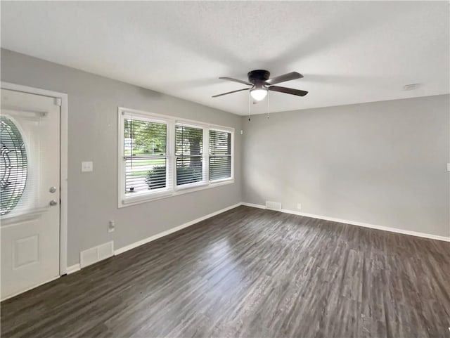 foyer entrance featuring dark hardwood / wood-style flooring and ceiling fan