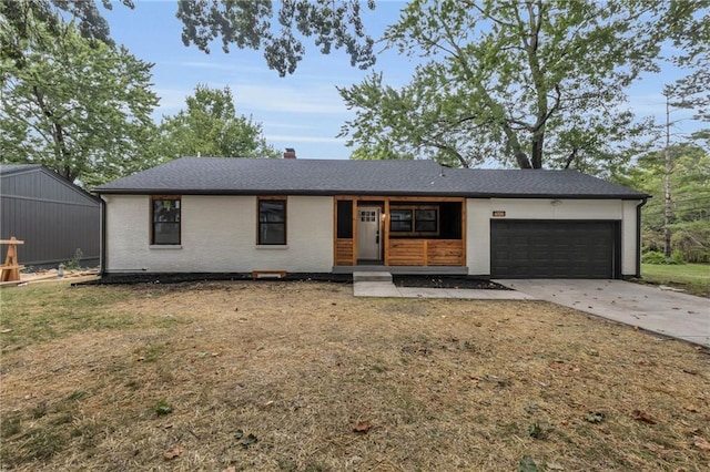 single story home with a garage, a front yard, and a porch