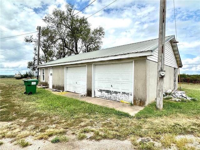 garage with a lawn