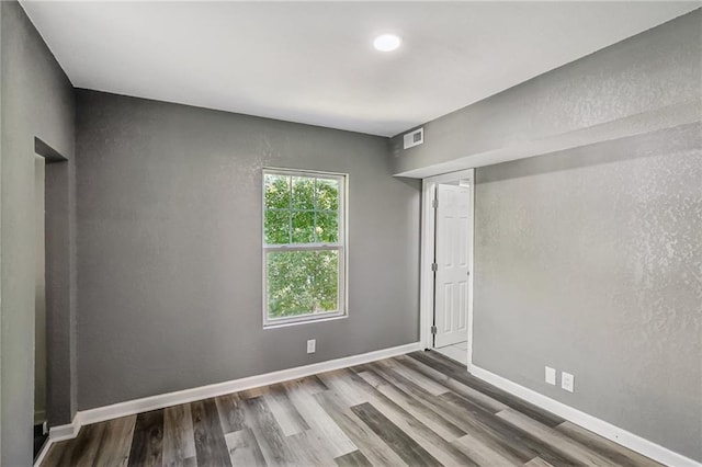 unfurnished room featuring hardwood / wood-style floors