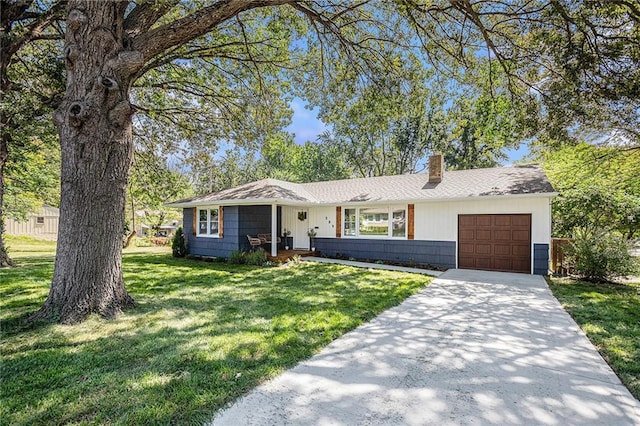 ranch-style home featuring a front yard and a garage