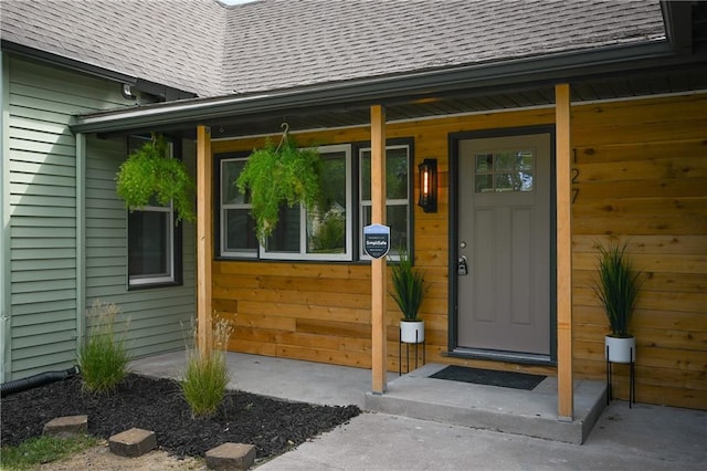 doorway to property featuring covered porch