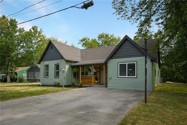 view of front facade with a carport and a front yard