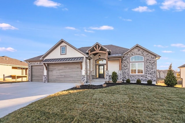 view of front of house featuring a garage and a front yard