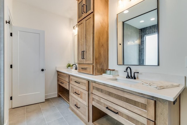 bathroom featuring tile patterned floors and vanity