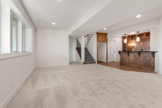 unfurnished living room with light carpet