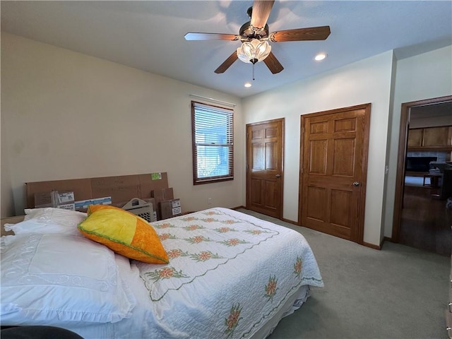 carpeted bedroom with ceiling fan