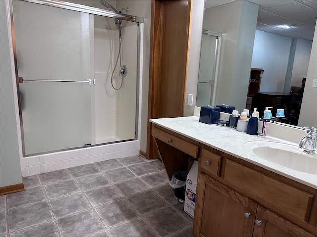 bathroom with an enclosed shower and vanity