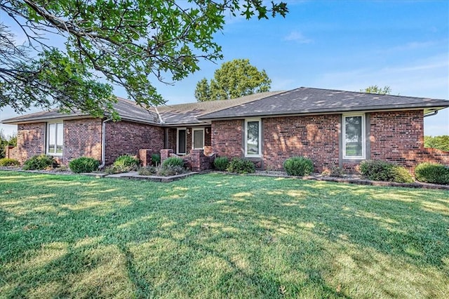 ranch-style home with a front yard