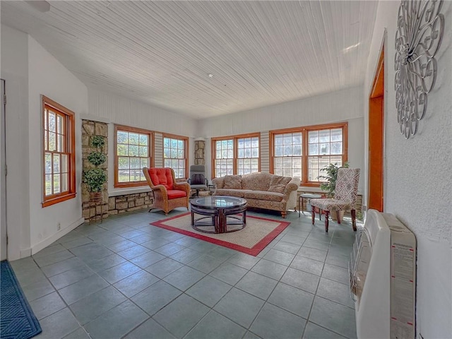 living room with a healthy amount of sunlight and tile patterned floors