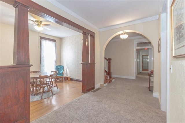 hall featuring crown molding and carpet flooring