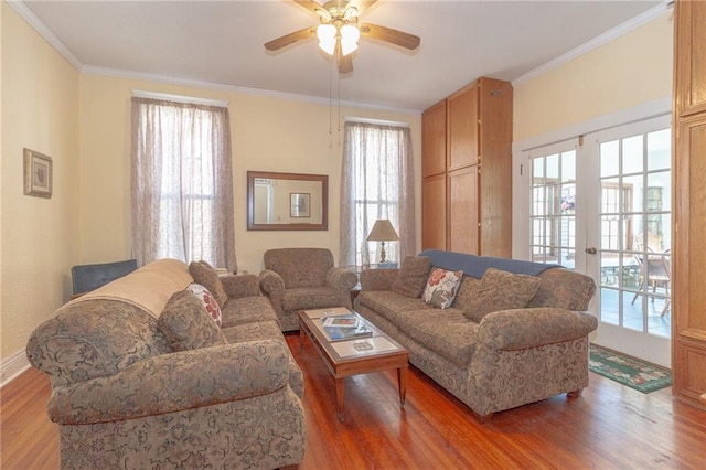 living room featuring plenty of natural light, hardwood / wood-style floors, and ceiling fan