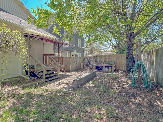 view of yard with a wooden deck