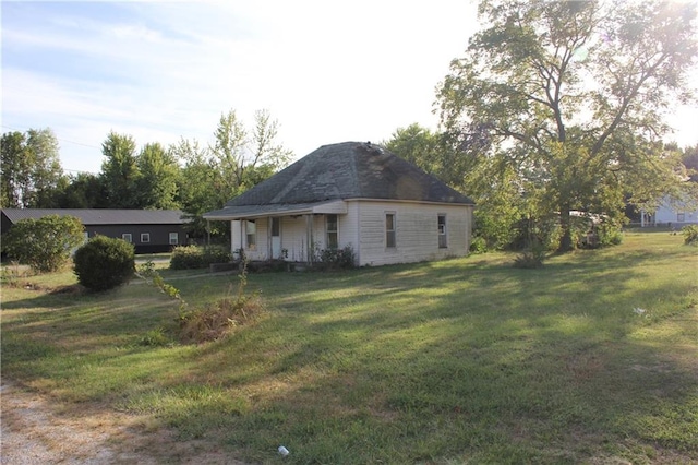 view of property exterior featuring a yard