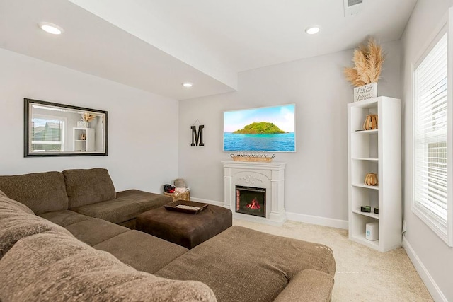 carpeted living room featuring a healthy amount of sunlight