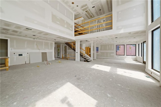 unfurnished living room with plenty of natural light