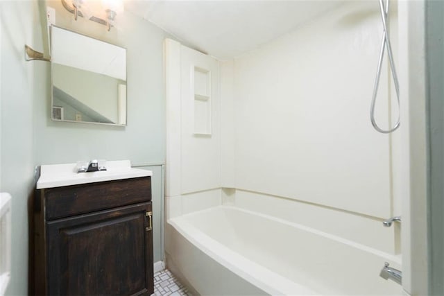 bathroom featuring washtub / shower combination and vanity