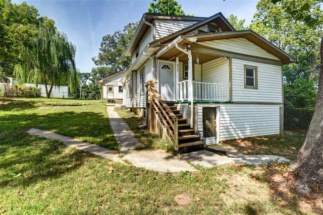 view of front of home with a front yard