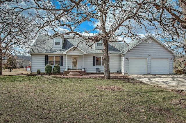 view of front of property with a front yard and a garage