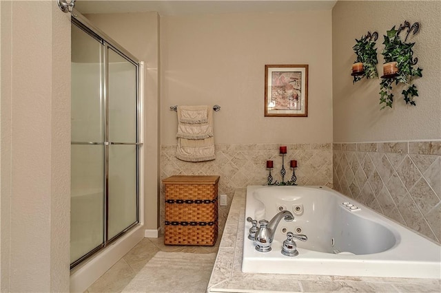 bathroom featuring shower with separate bathtub and tile patterned floors