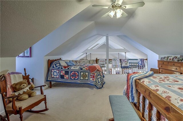 carpeted bedroom featuring vaulted ceiling, a textured ceiling, and ceiling fan