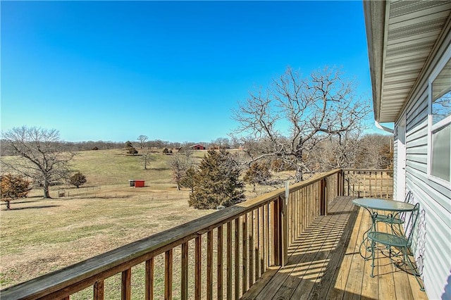 wooden terrace featuring a rural view