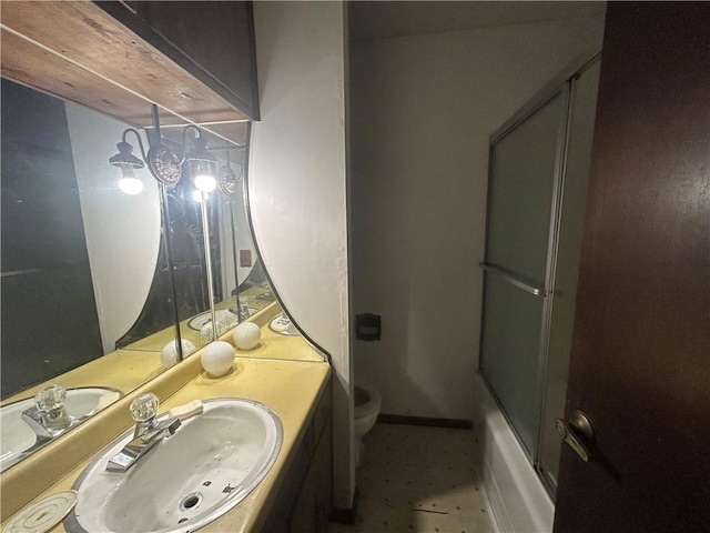 full bathroom featuring enclosed tub / shower combo, toilet, and vanity