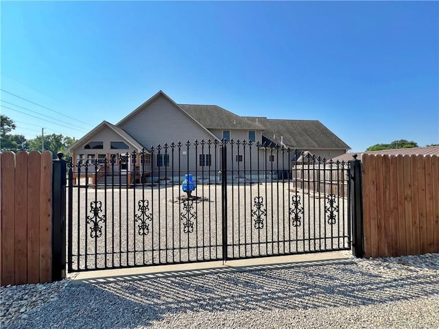 view of gate with a garage