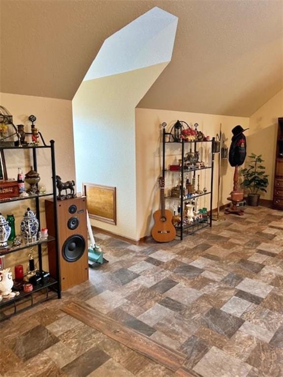 exercise room with lofted ceiling