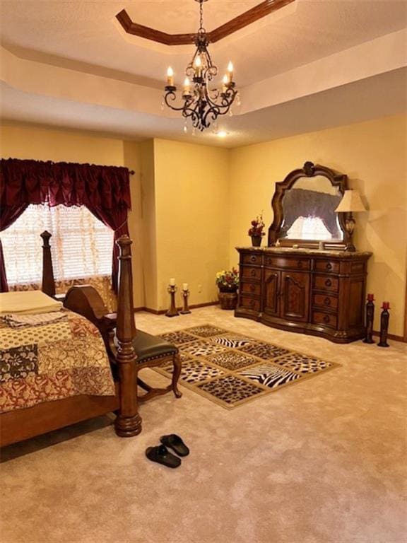 bedroom with a raised ceiling, a notable chandelier, and light colored carpet