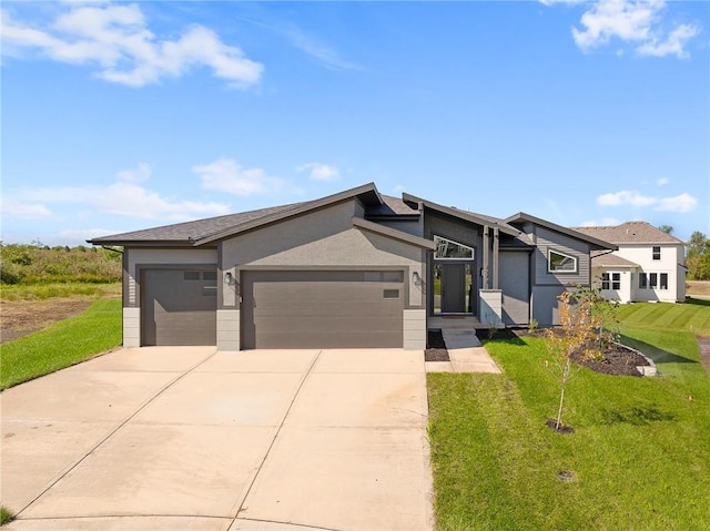 view of front of house with a front lawn and a garage