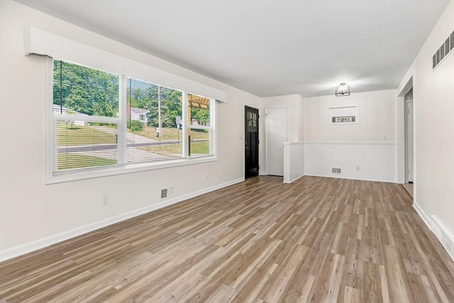 unfurnished living room featuring light hardwood / wood-style flooring