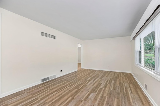 spare room with light hardwood / wood-style floors