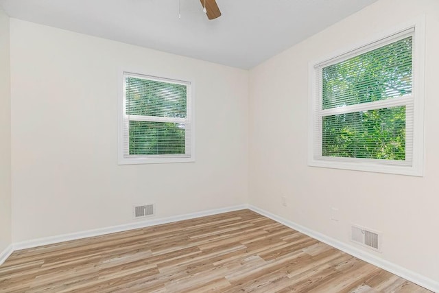 spare room with ceiling fan and light hardwood / wood-style flooring