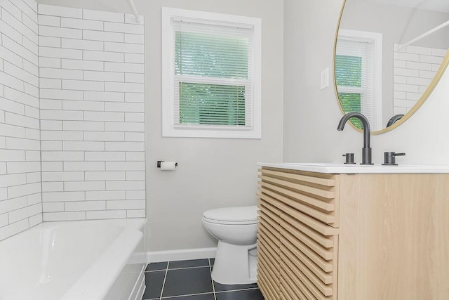 full bathroom featuring tile patterned floors, vanity, toilet, and tiled shower / bath