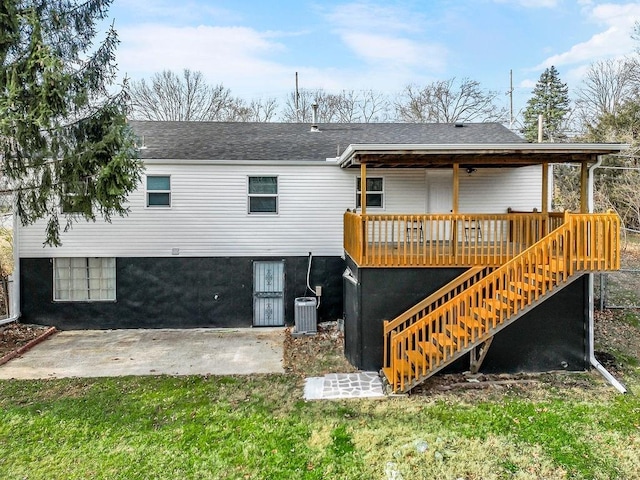 back of property with a yard, central AC unit, a patio area, and a wooden deck